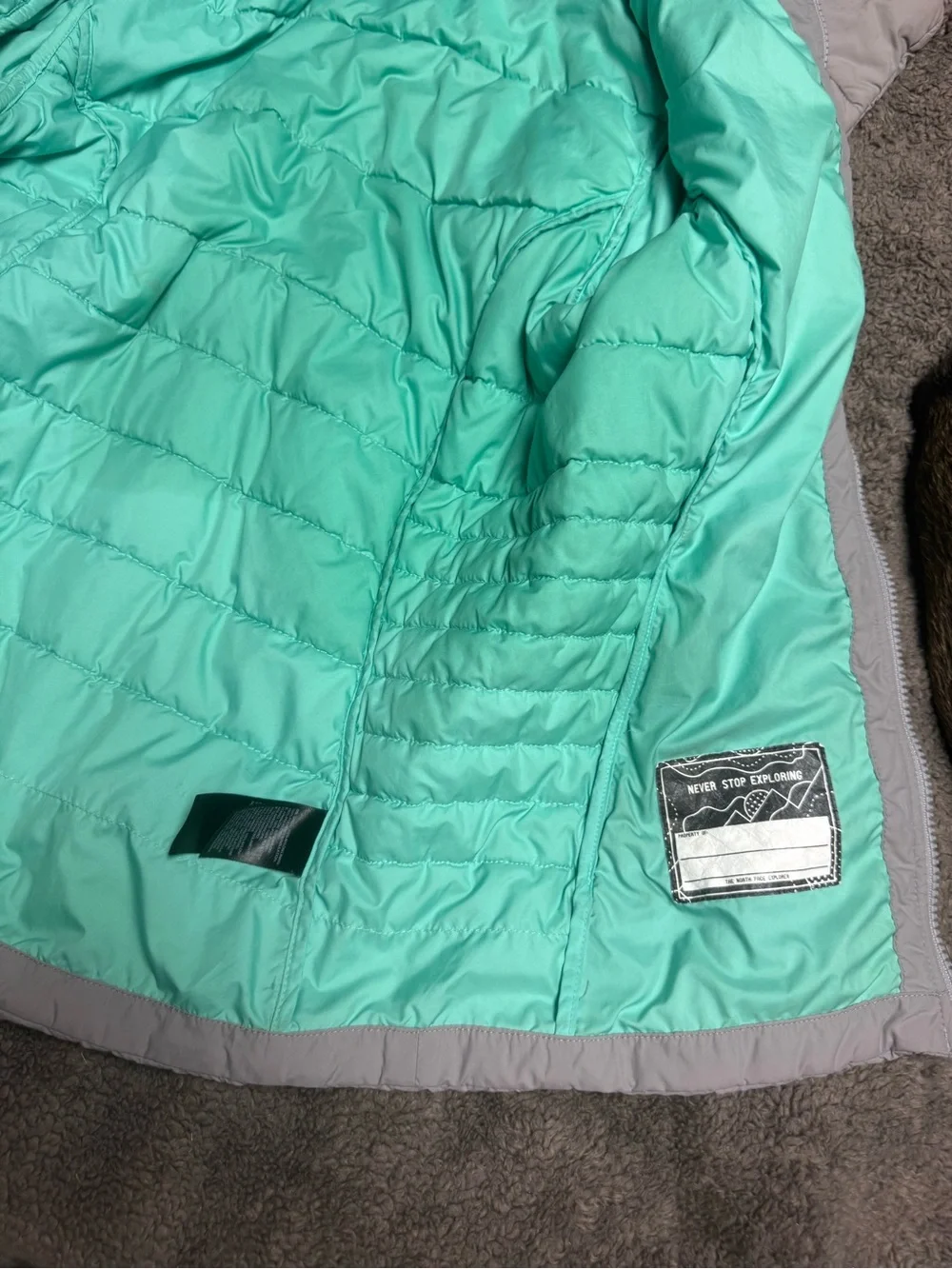 The North Face girls Grey Quilted Insulated Jacket